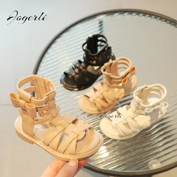 Новые летние римские сандалии для девочек с бантиком-бабочкой, легкие детские туфли на плоской подошве, тканая обувь принцессы на мягкой подошве Изображение